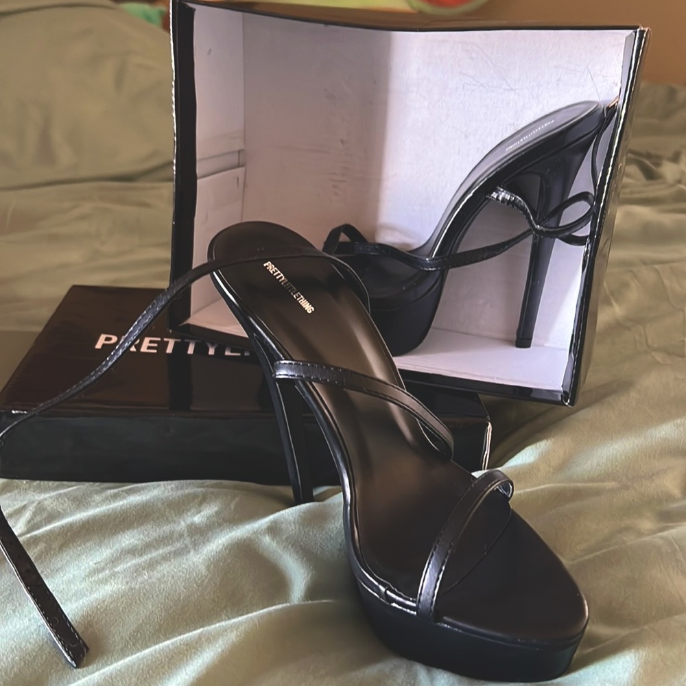 Black pretty little thing shoes, never worn still in the box -woman’s size 7